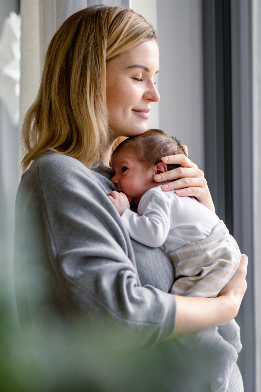 image of new mother with her newborn